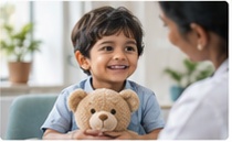 Paediatric doctor examining young child with comforting teddy bear